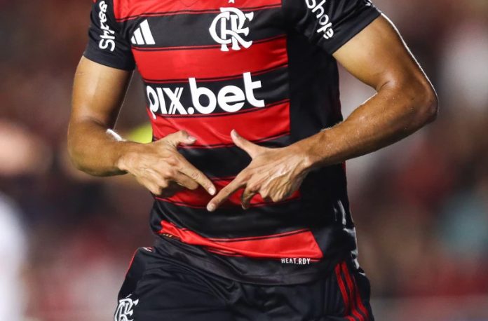 Comemoração de gol de Juninho, que significa um V